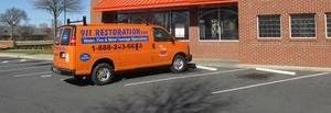 Water and Mold Damage Restoration Van Parked At Job